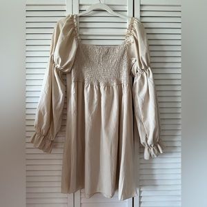 Tan puff sleeve smocked dress.